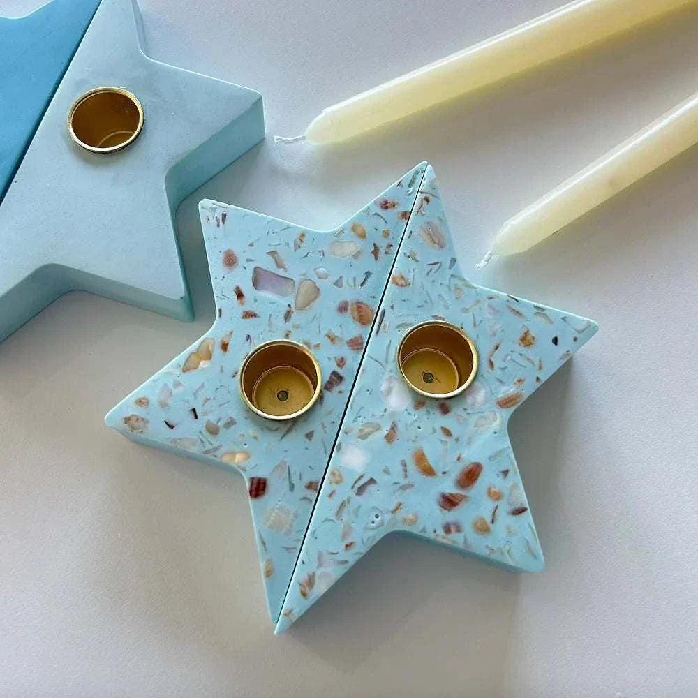 Seashell terrazzo Magen David Shabbat candlesticks with gold-toned inserts, handcrafted by Made by Dalia.