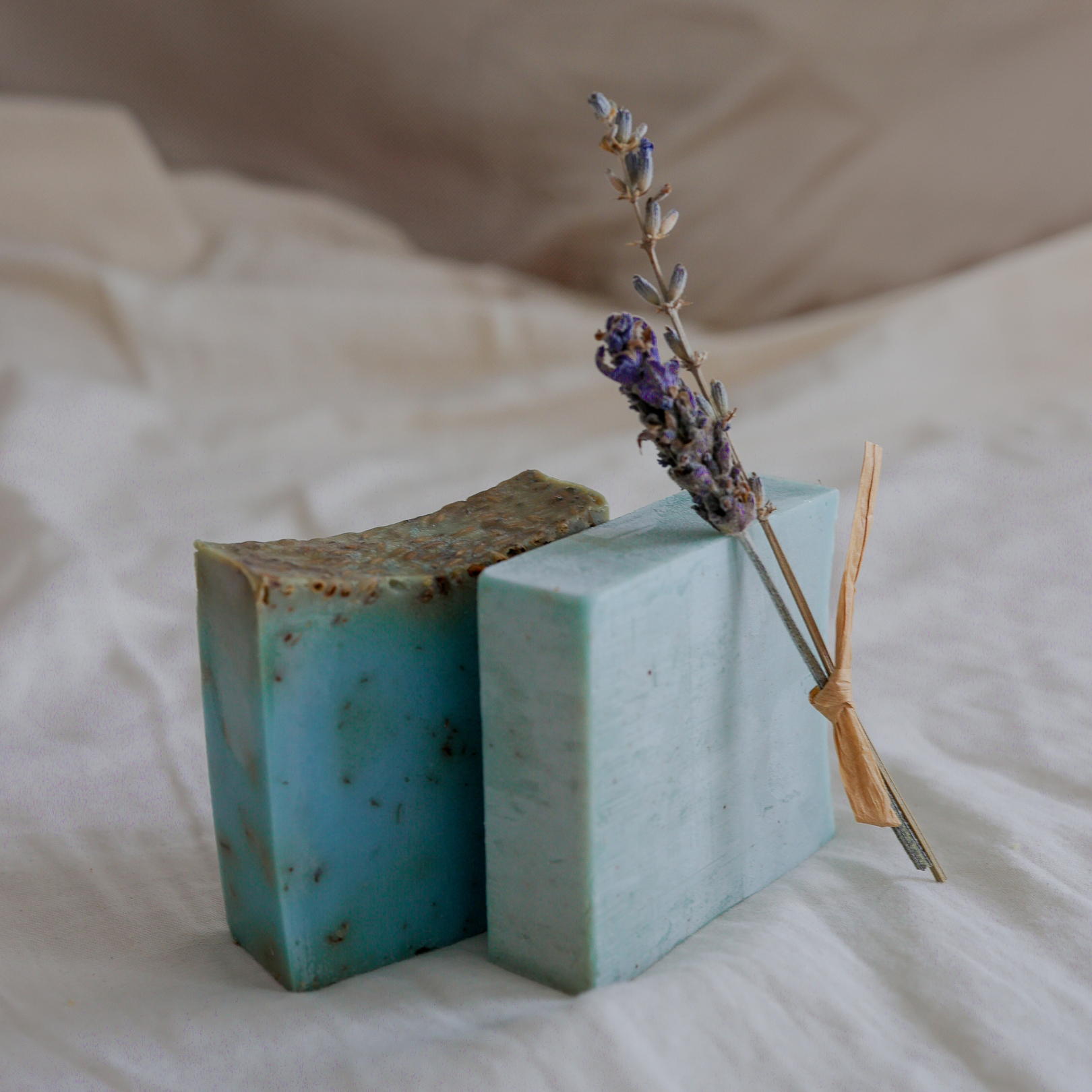 Two bars of handmade lavender soap with dried lavender sprig, natural artisanal soap pack from Israeli desert