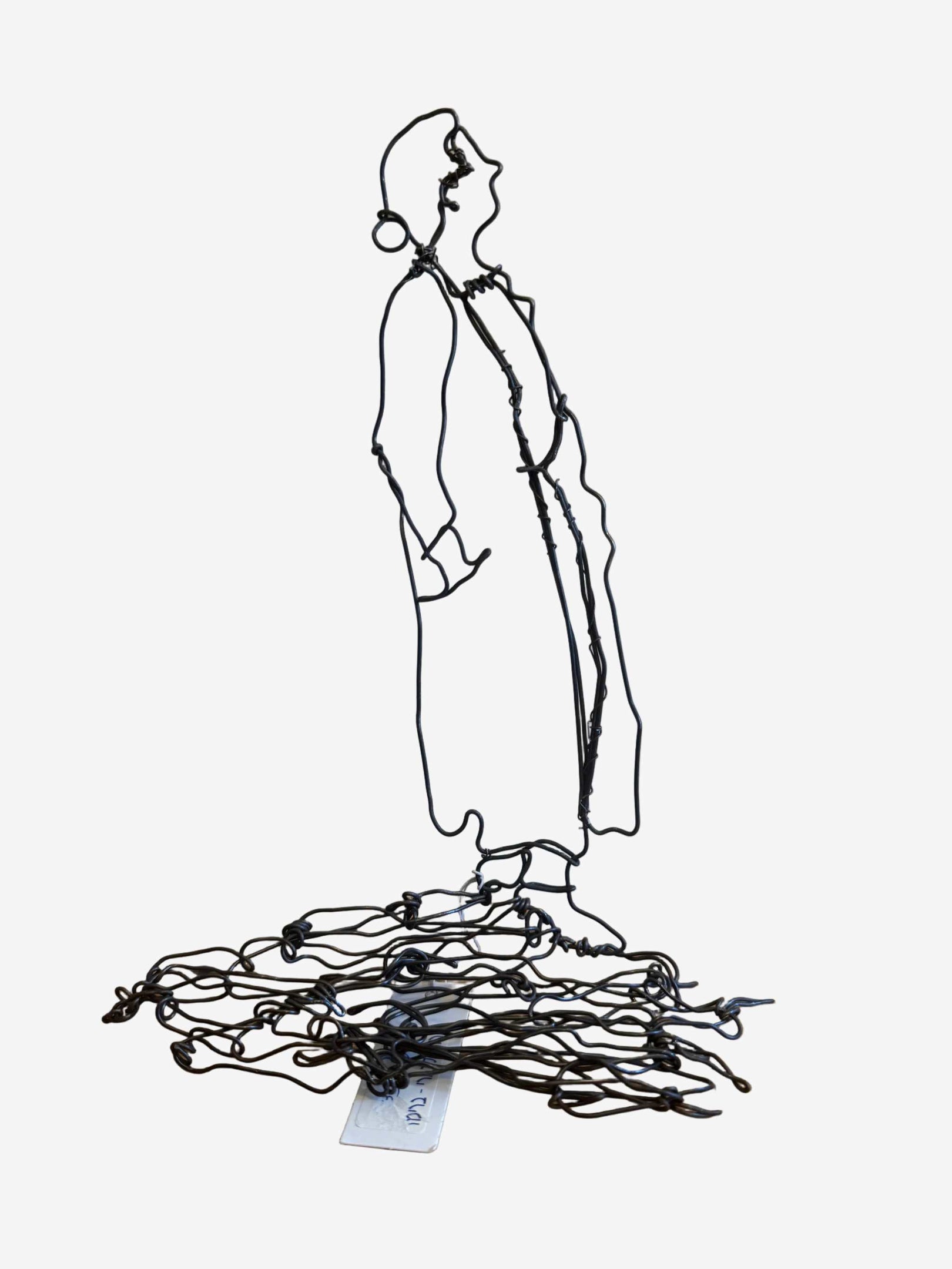 Handcrafted wire figurine sculpture by Vered Brimmer depicting a delicate, minimalist human form in iron wire