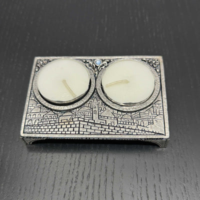 Silver-plated Jerusalem inspired travel candle holder with embossed motif and blue stone centerpiece for Shabbat lighting