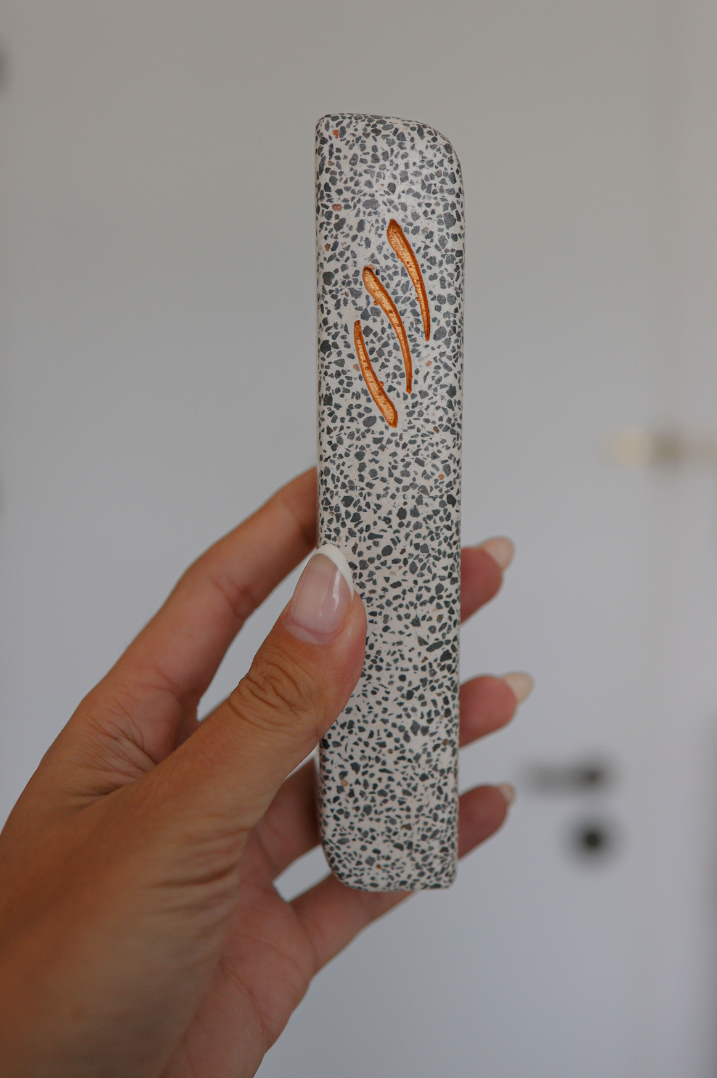 hand holding Basalt Large Mezuzah