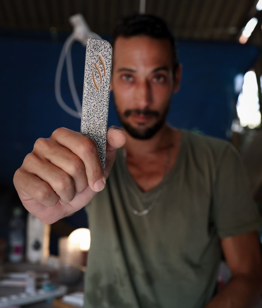 Artist Barak holding Basalt Medium Mezuzah