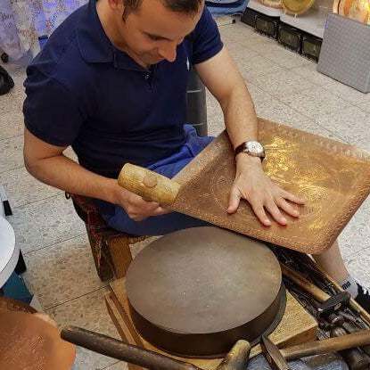 Handcrafted silver and copper Seder plate by David Miro with traditional hammered design from Israel