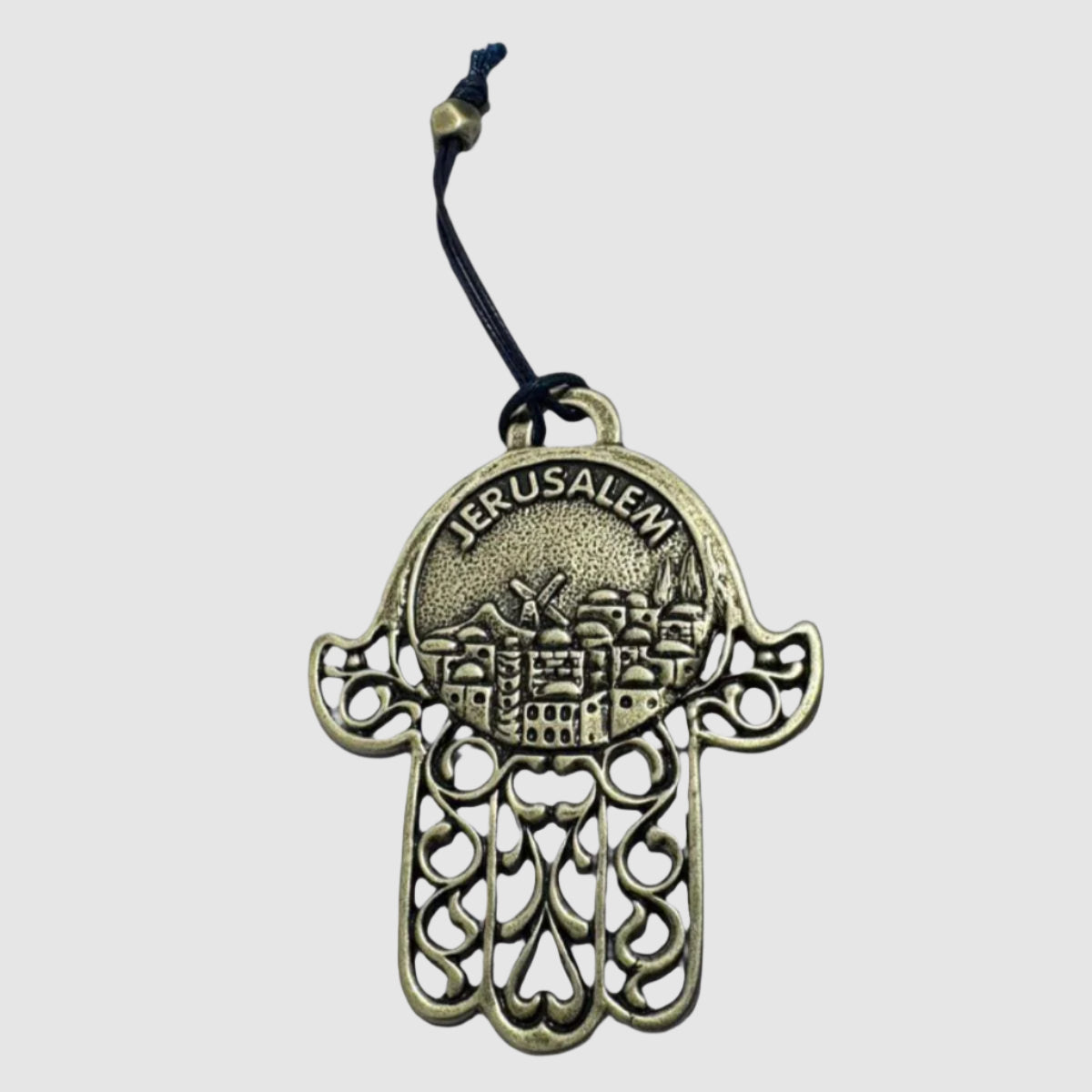 Handcrafted antique silver finish Hamsa wall art featuring intricate Jerusalem engraving with hanging cord from Elad Casting Studio