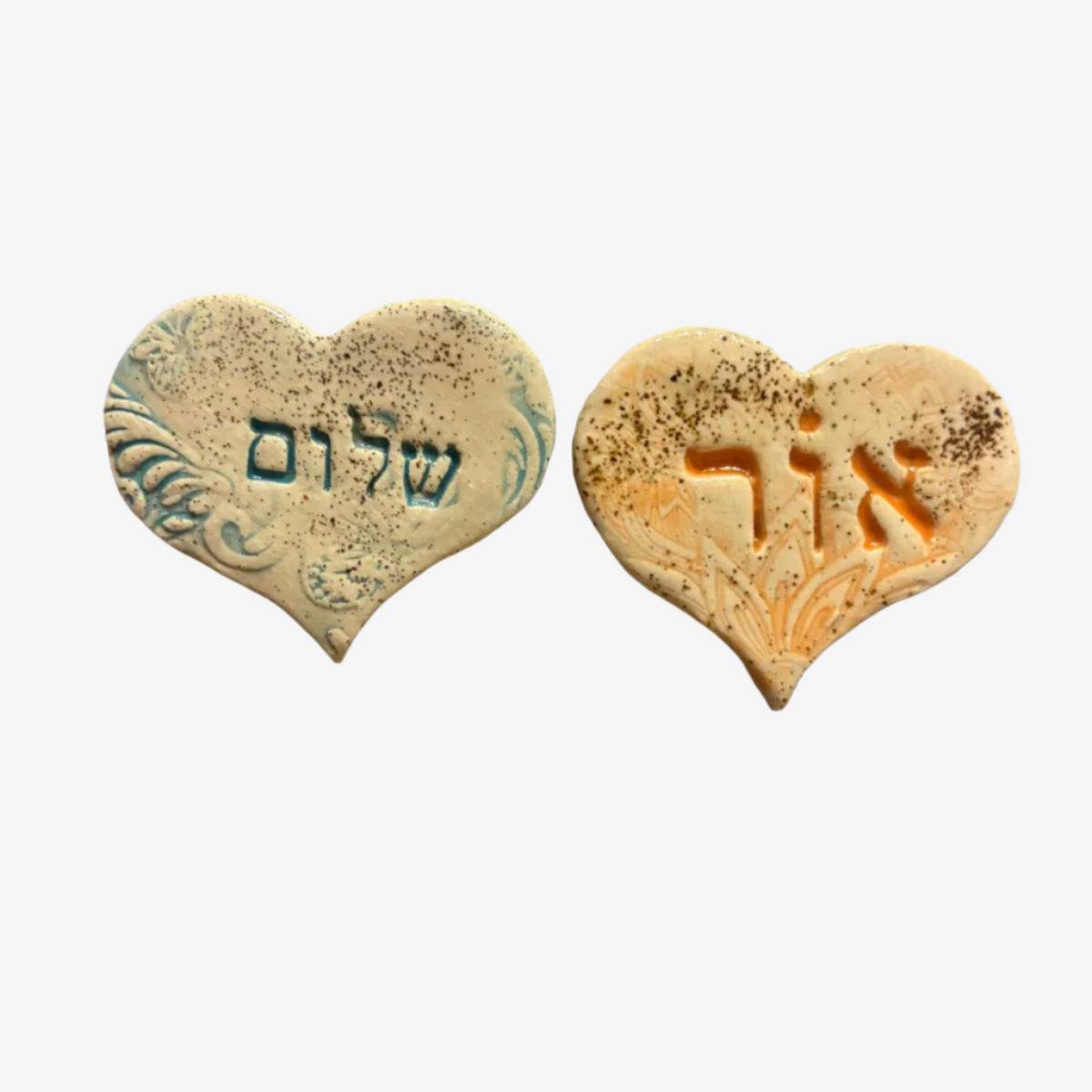 Handmade Israel ceramic heart magnet with Hebrew inscription by Beit HaMelacha, symbolizing love and hope