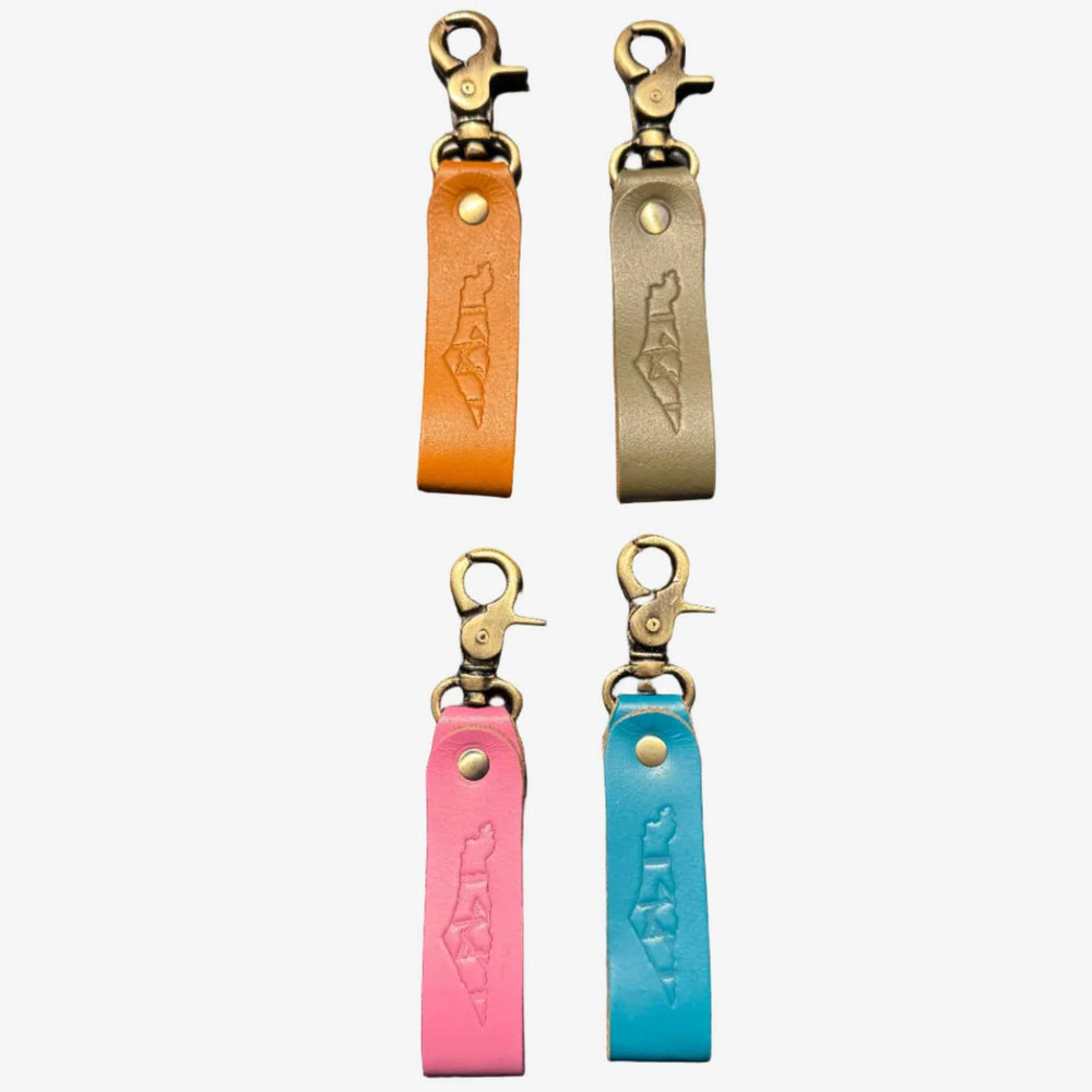 Handcrafted minimalist leather keychain in blue and tan with geometric design by Mor Sinai