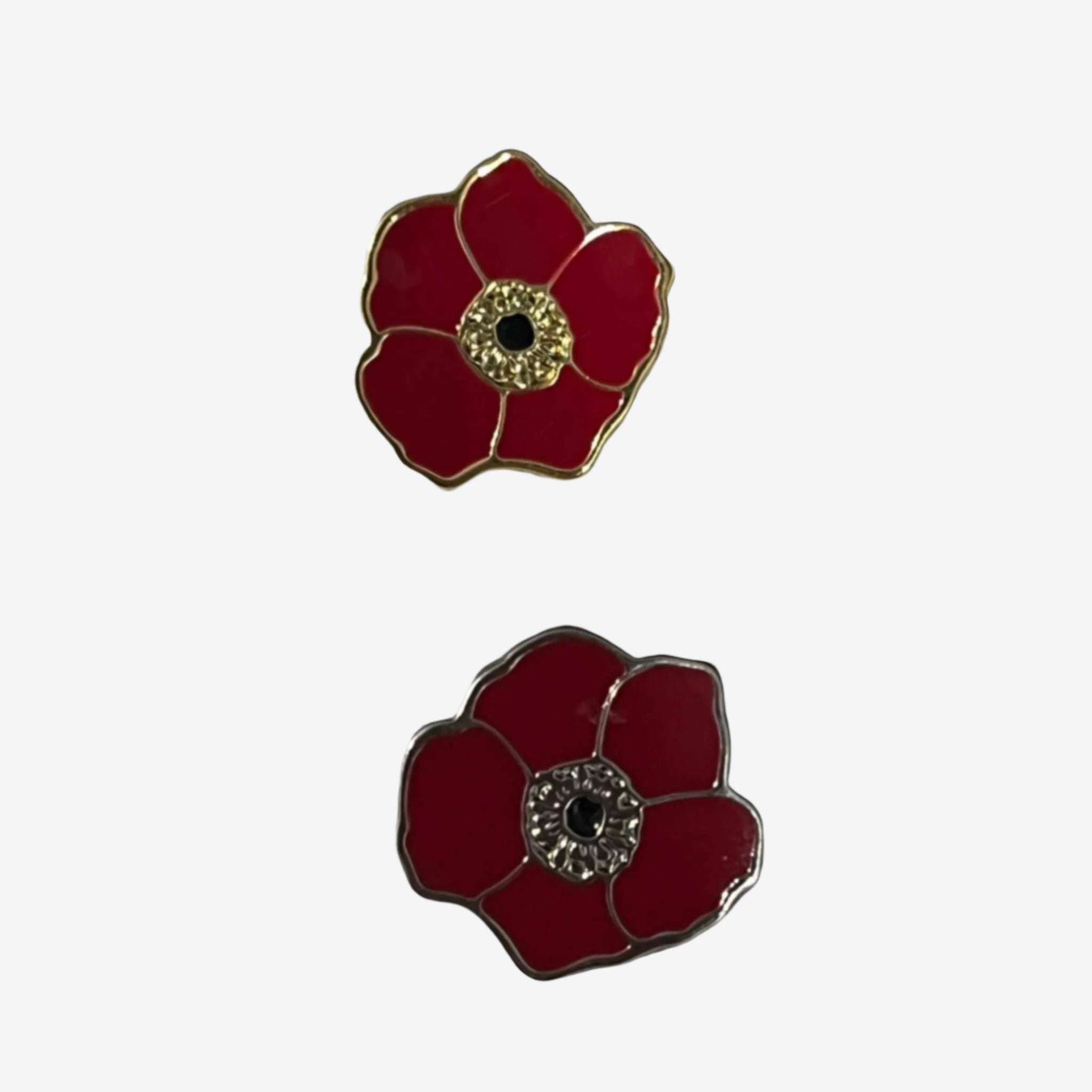 Two Kalanit red poppy enamel pins in gold and silver finishes symbolizing support for Israel hostages families