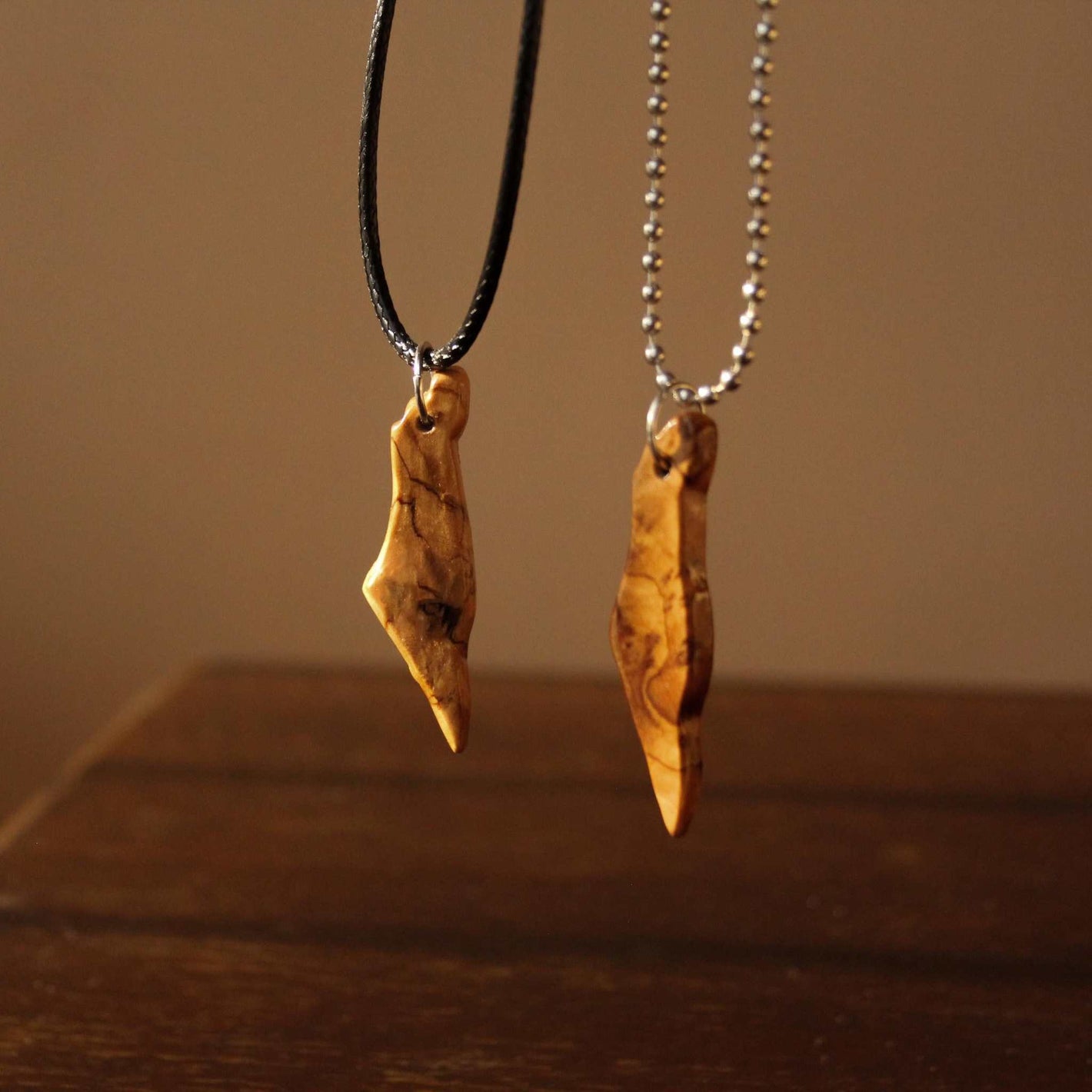 Handmade olive wood necklace from Israel with natural grain and smooth finish
