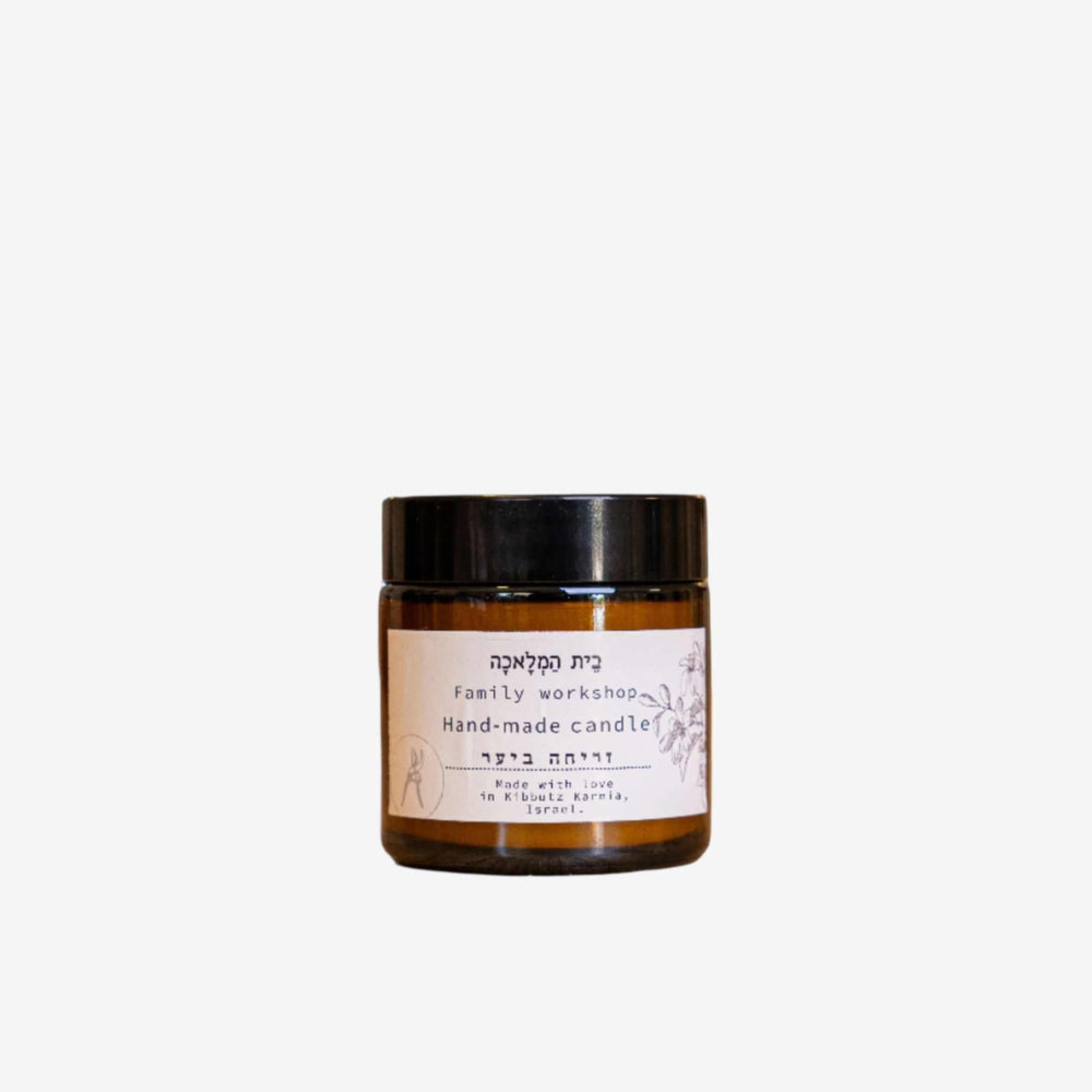 Handcrafted natural beeswax candle from Beit HaMelacha with subtle scent and minimalist design