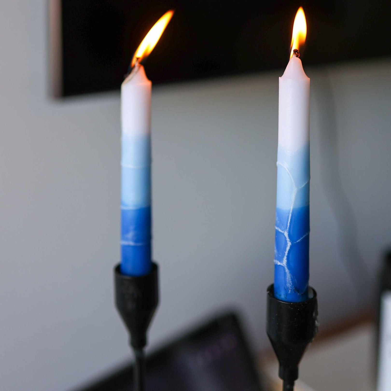 Pair of handcrafted dripless Shabbat candles from Safed with vibrant colors and clean burn