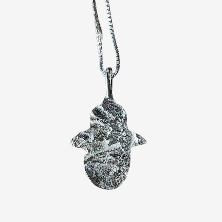 Silver Jerusalem Stone Hamsa necklace crafted from 925 sterling silver with textured Jerusalem stone finish by Sapir