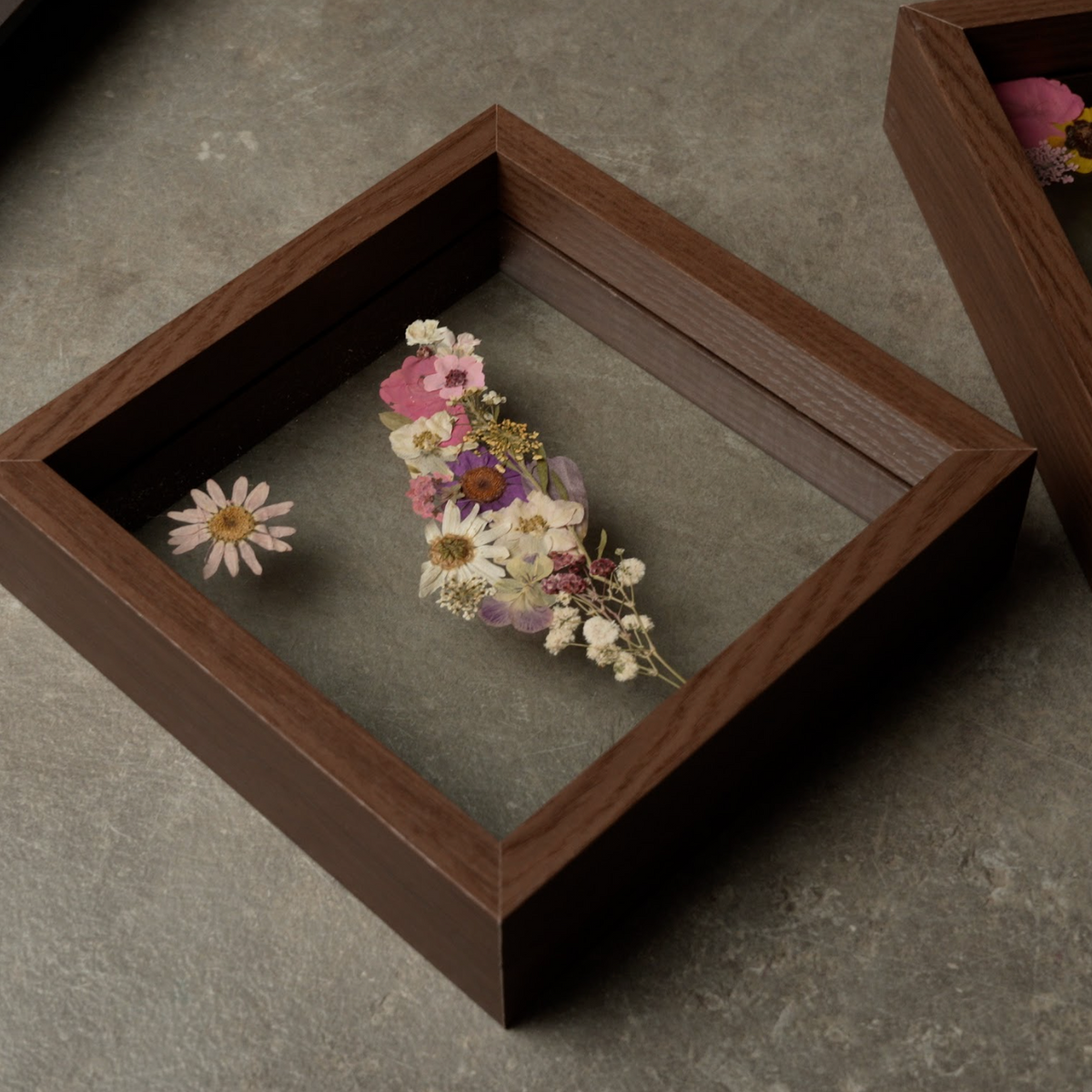 Pressed Flowers Framed Map featuring colorful dried flowers in an open dark wooden frame with clear glass 
