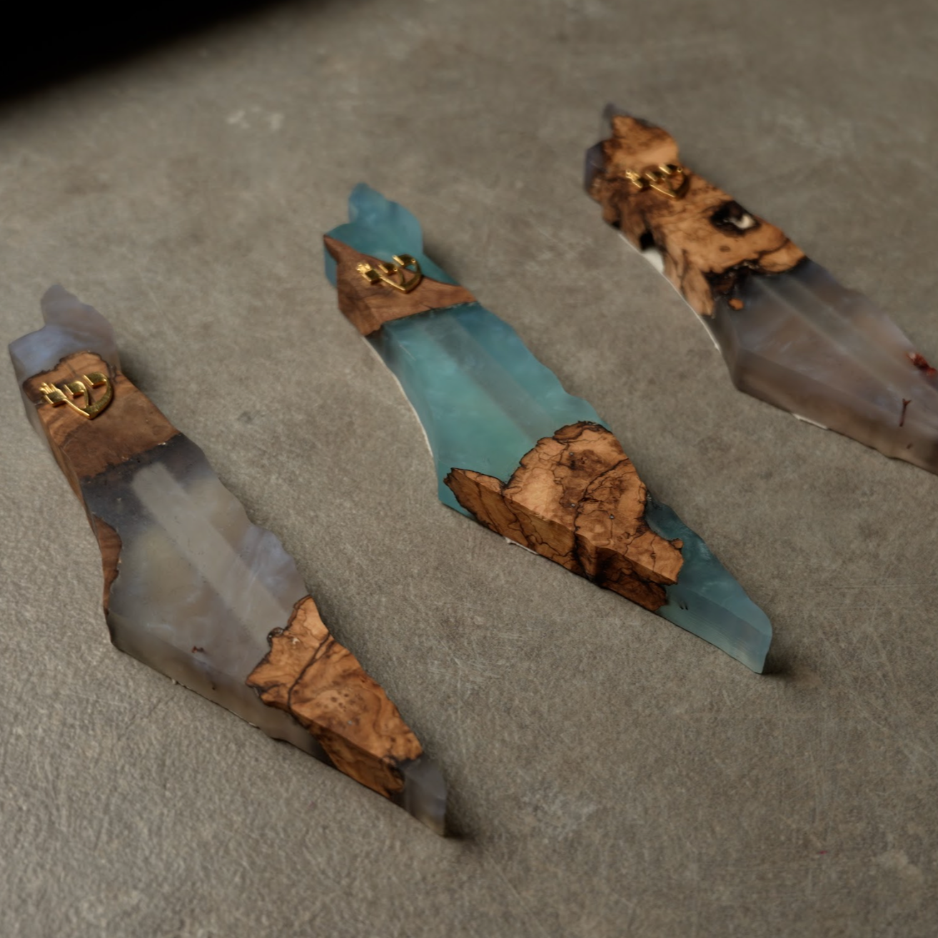 Handmade epoxy and olivewood mezuzahs with unique natural wood grain and translucent epoxy design