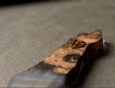 Handmade epoxy and olive wood mezuzah by Mai Gini with natural grain and smooth resin finish
