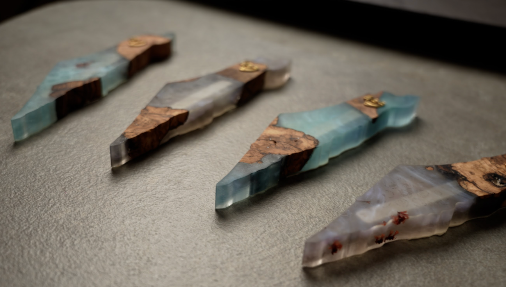 Handmade epoxy and olivewood mezuzahs with pressed flowers and glass layers in Land of Israel shape