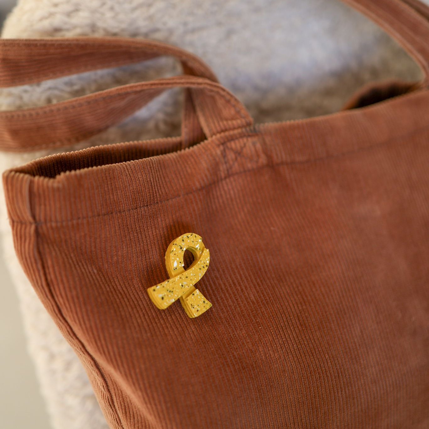 Terrazzo Yellow Ribbon Hostage Pin on Bag