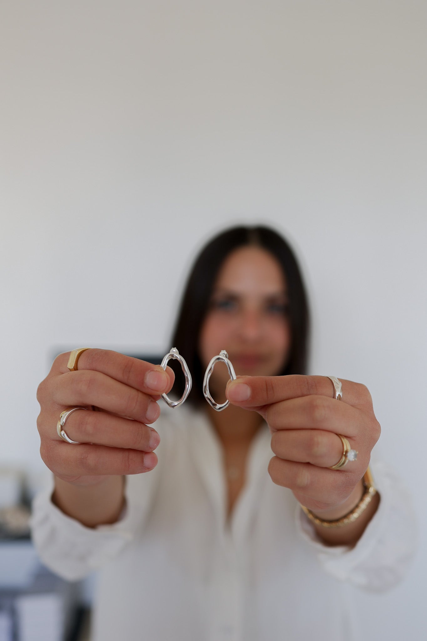 Sharon holding VER Lola Earrings