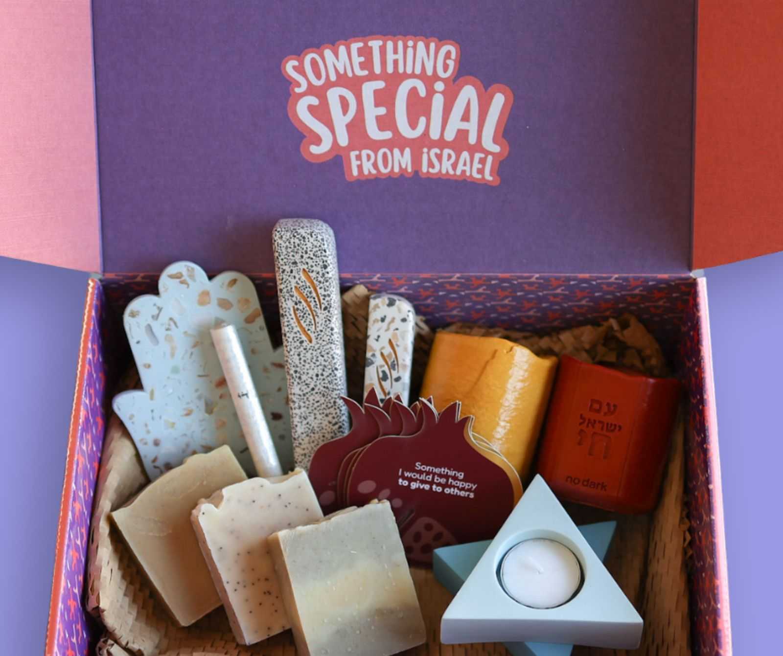 Gift box from Israel with handcrafted Judaica, soaps, and decorative items to support evacuated families and small businesses.