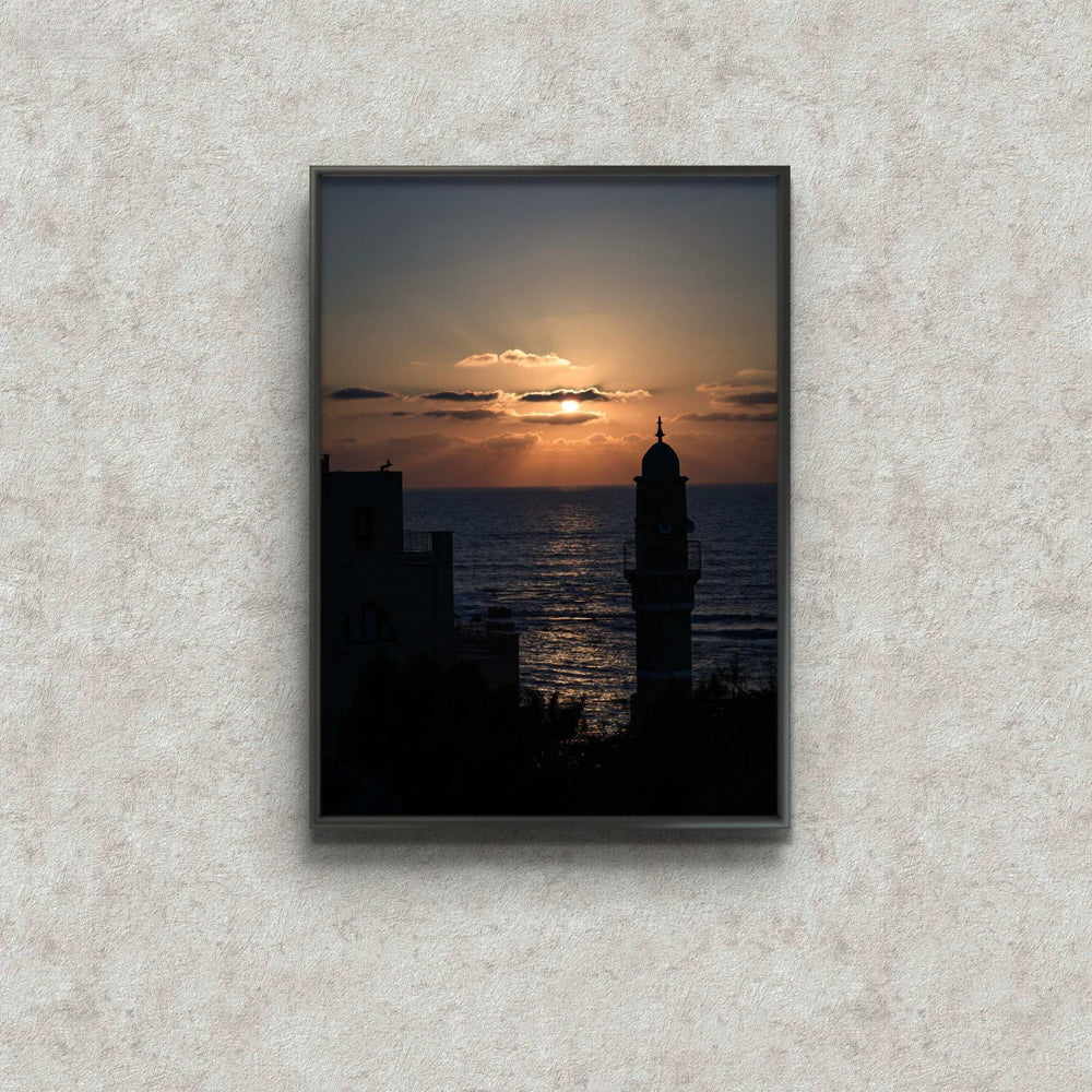 Jaffa at dusk framed print by Shye Klein showing sunset over city and sea with warm reflections