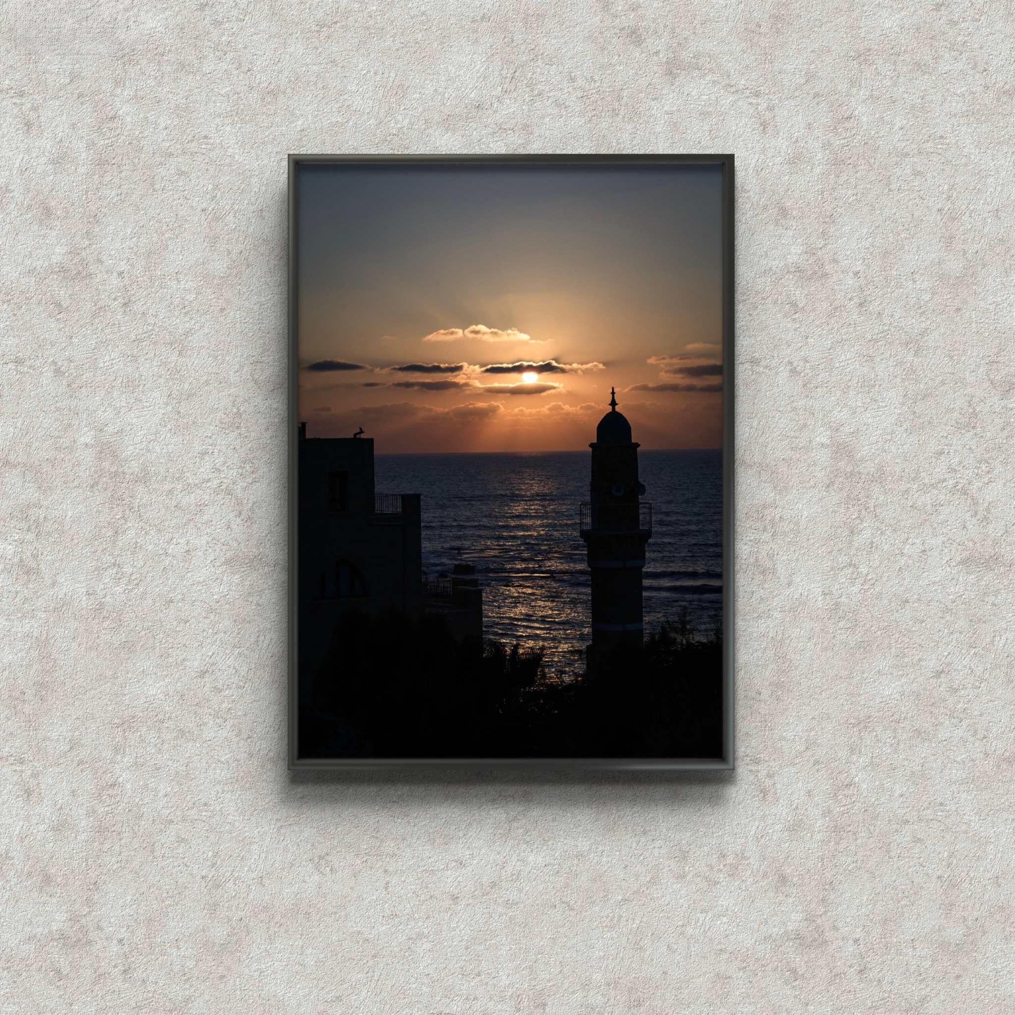 Jaffa at dusk framed print by Shye Klein showing sunset over sea and city silhouette