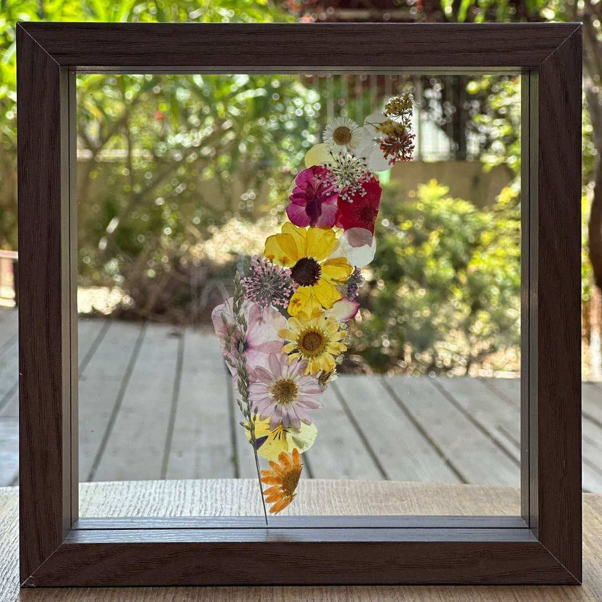 Pressed Flowers Framed Map featuring colorful pressed blooms arranged in Israel’s shape behind glass, with a wooden frame