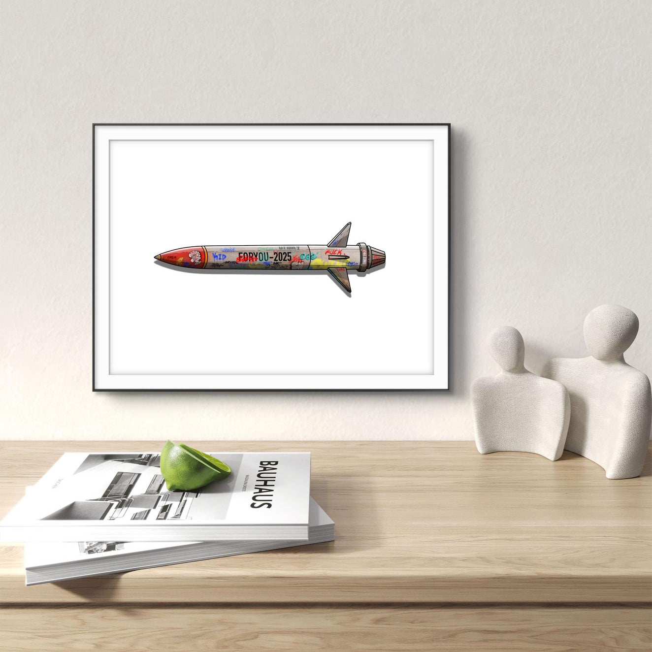 Illustrated rocket art print framed on white wall with graffiti style and colorful design