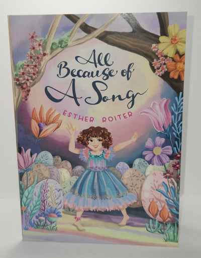 ADI All Because of a Song children’s book with a colorful illustrated cover, featuring a girl in a blue dress among flowers and trees.