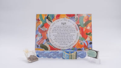 ADI Havdalah Set with a colorful floral blessing card, blue braided candle, spice pouch and small tin container.