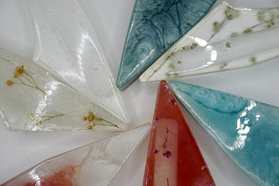 ADI Acrylic Mezuzah Case in translucent acrylic, with pointed triangular forms, marbled swirls and embedded botanical details in assorted colours.