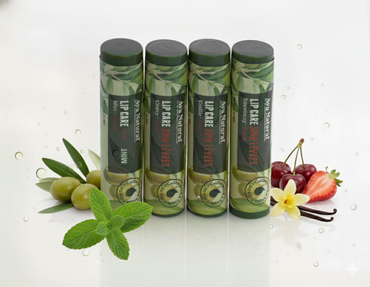 Aya Natural Lip Care balm tubes in green botanical-patterned packaging, with mint, olive, strawberry, cherry and vanilla varieties.
