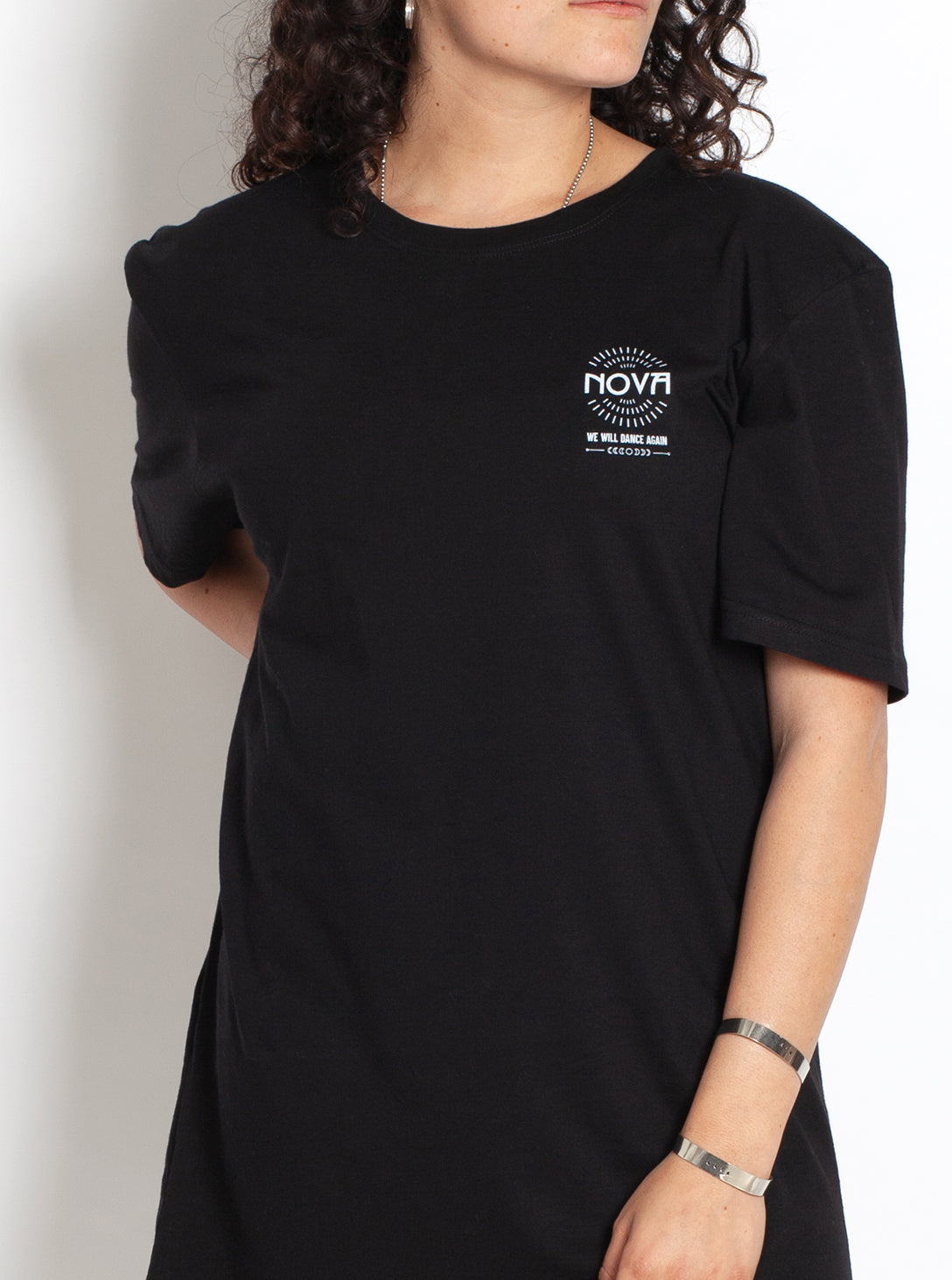 Nova Names T-Shirt in black cotton, featuring a small white Nova logo and text on the chest with short sleeves.