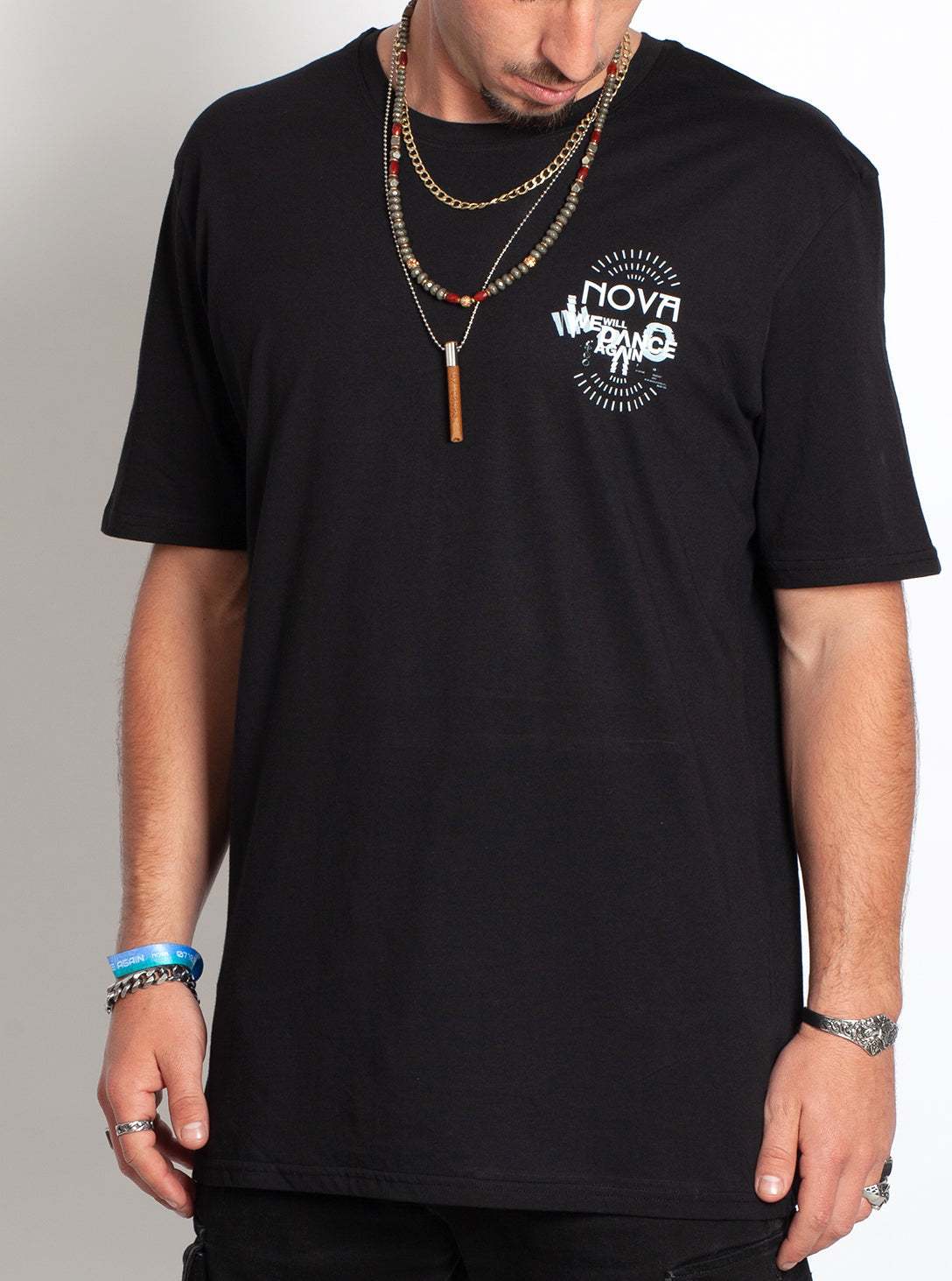 Nova We Will Dance Again T-Shirt in black cotton, with a small white Nova graphic on the chest and short sleeves.