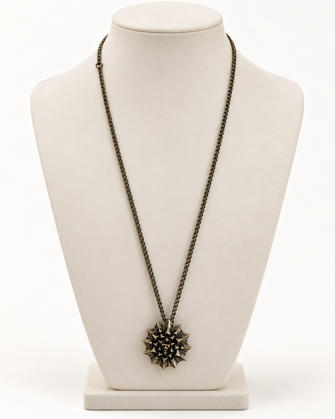 Nova Heaven Burning Man Necklace with a dark bronze-toned chain and spiky geometric sunburst pendant, likely metal.