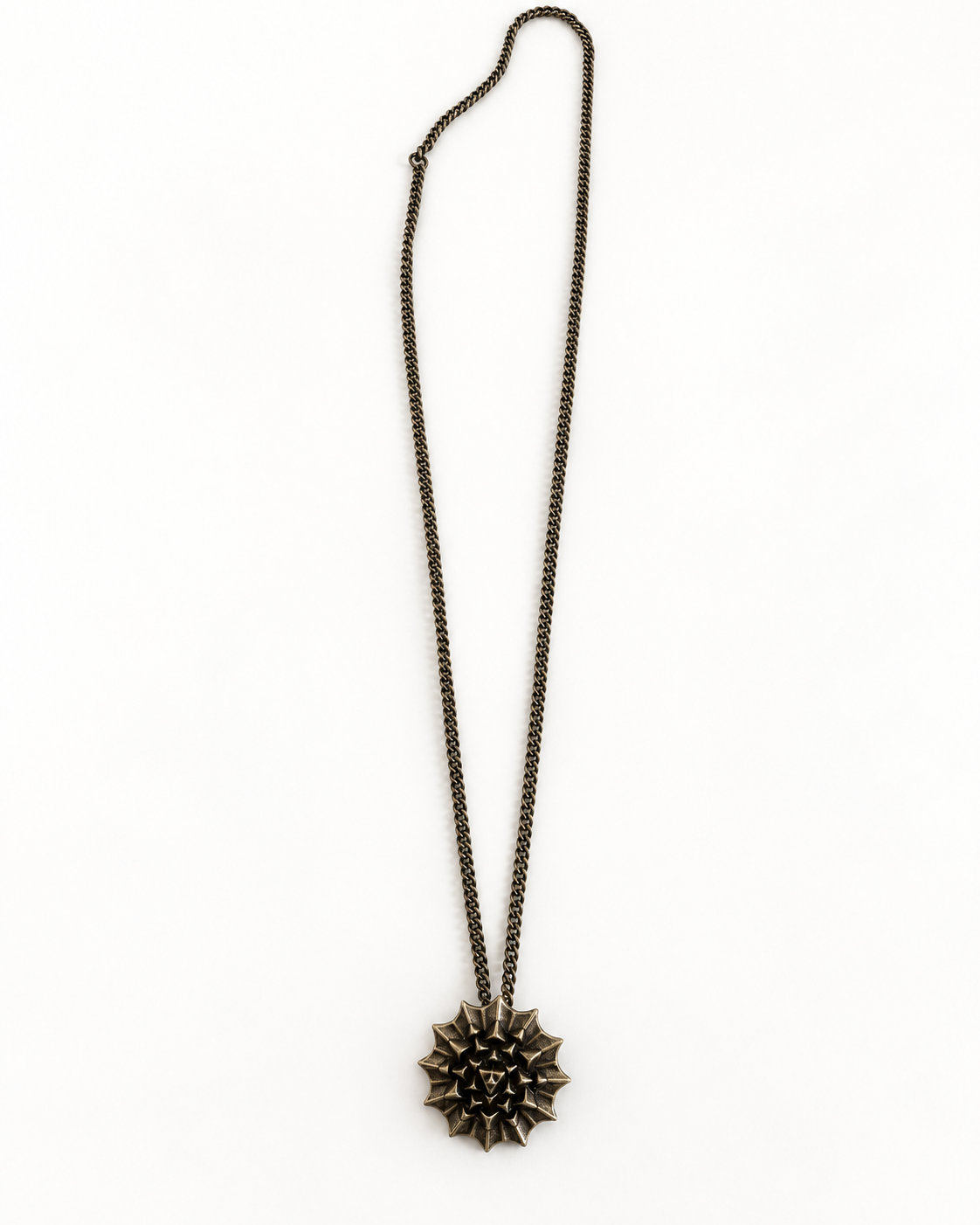 Nova Heaven Burning Man Necklace with a dark bronze-toned chain and sculptural, spiked sunburst pendant.