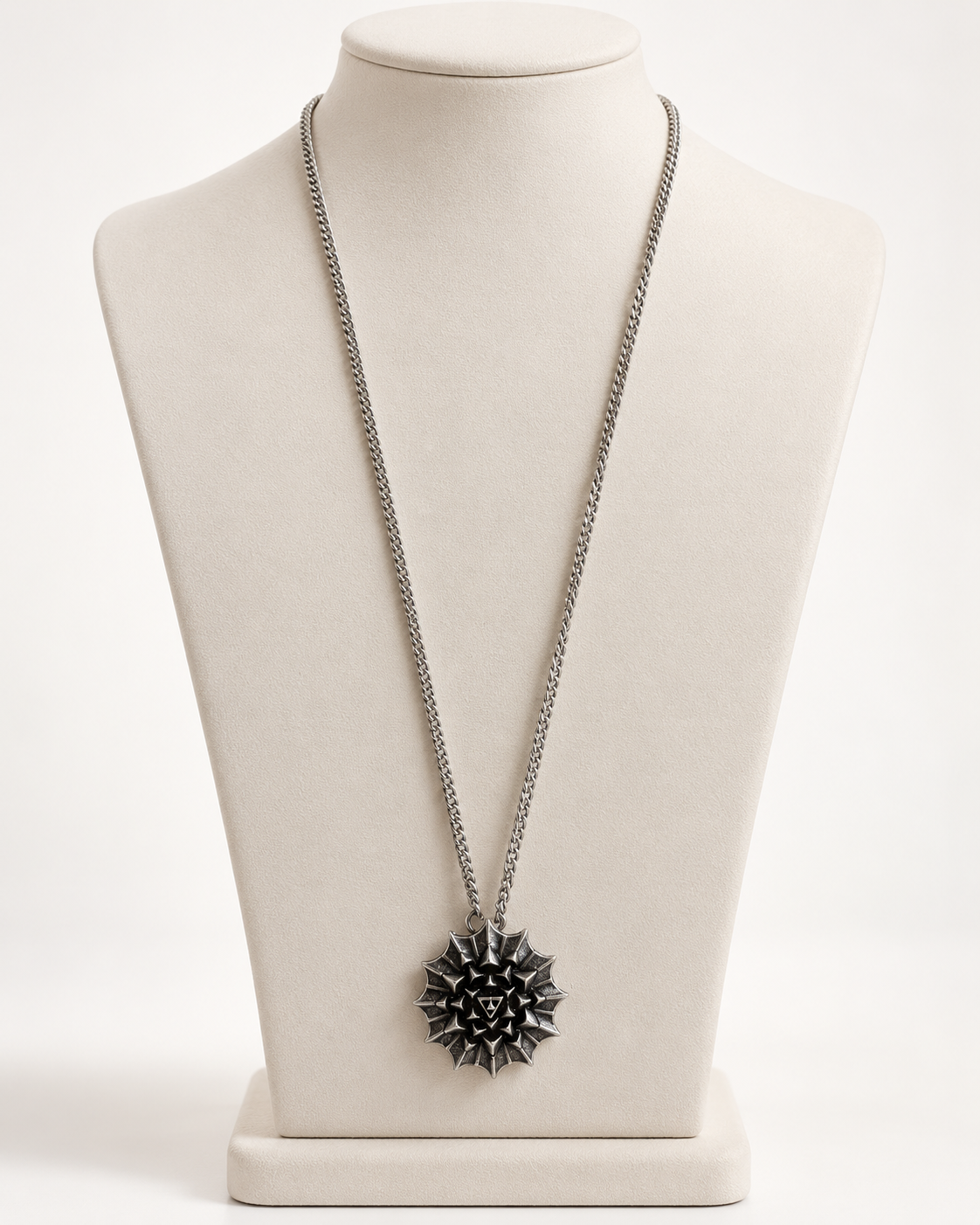 Nova Heaven Burning Man Necklace with a silver-tone chain and geometric black-and-silver sunburst pendant.