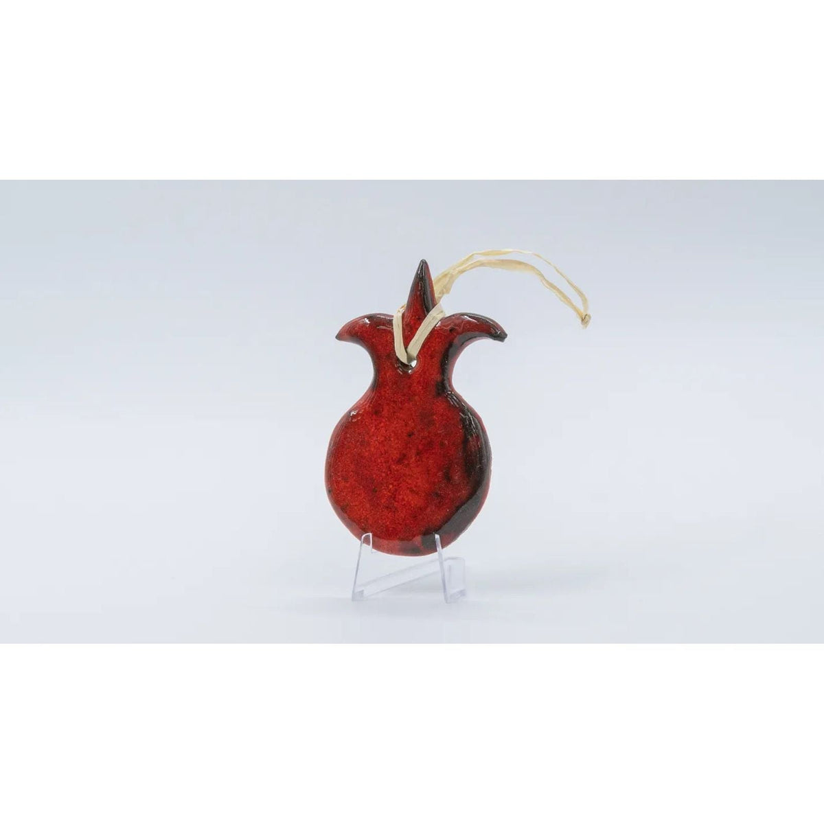 ADI Pomegranate Wall Decoration is a glossy red ceramic pomegranate ornament with a gold hanging loop and leafy crown.