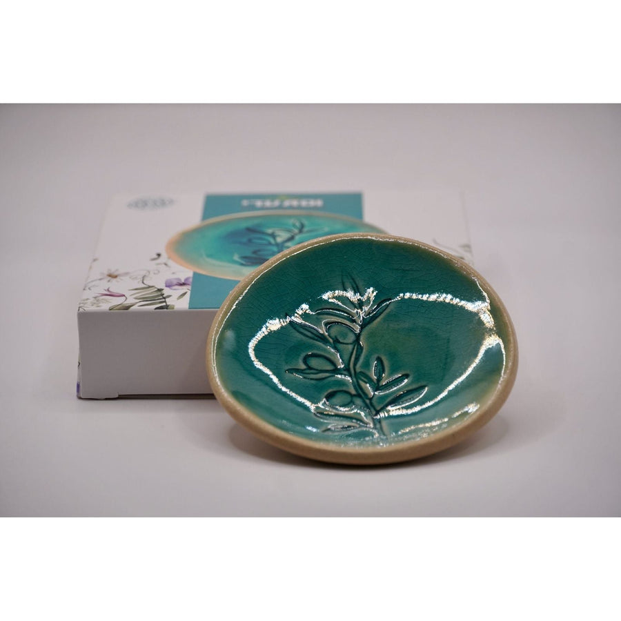 ADI Flower Plate, glossy teal ceramic dish with a raised silver flower design and tan rim