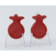 ADI Small Pomegranate Magnet in glossy red ceramic, shaped like rounded pomegranates with leafy crowns and hand-finished texture.
