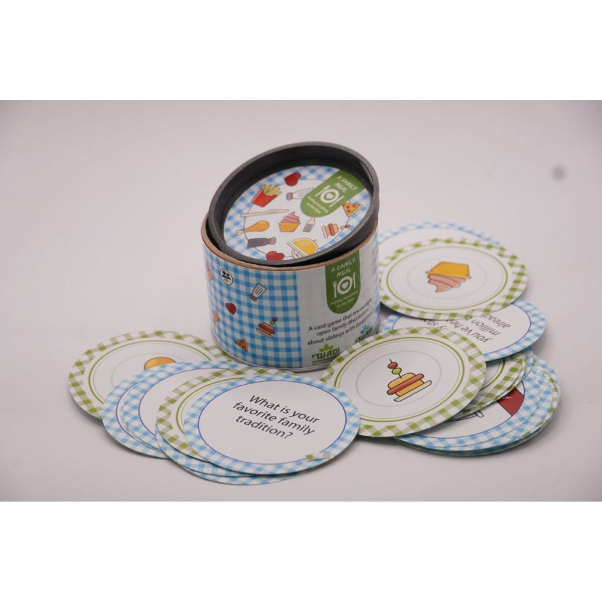 ADI A Family Meal Card Game in a blue gingham tin with round illustrated cards featuring colorful food and family prompts.