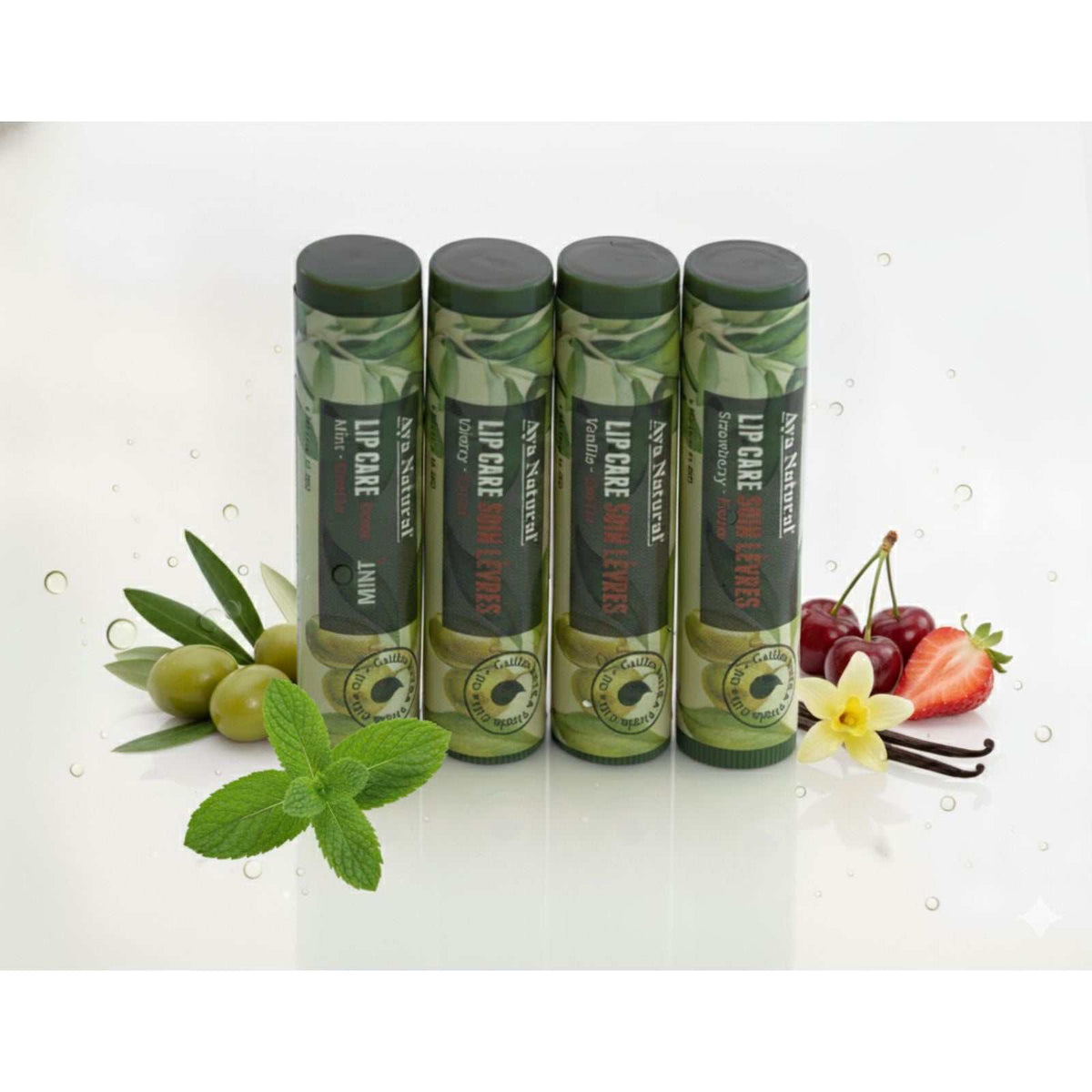 Aya Natural Lip Care lip balm set in green botanical-print tubes with dark caps, featuring mint, olive, cherry and strawberry flavours