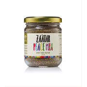 Za’atar seasoning in a clear glass jar with a gold lid and colourful “Peace Mix” label, Sindyanna of Galilee Za'atar Blend