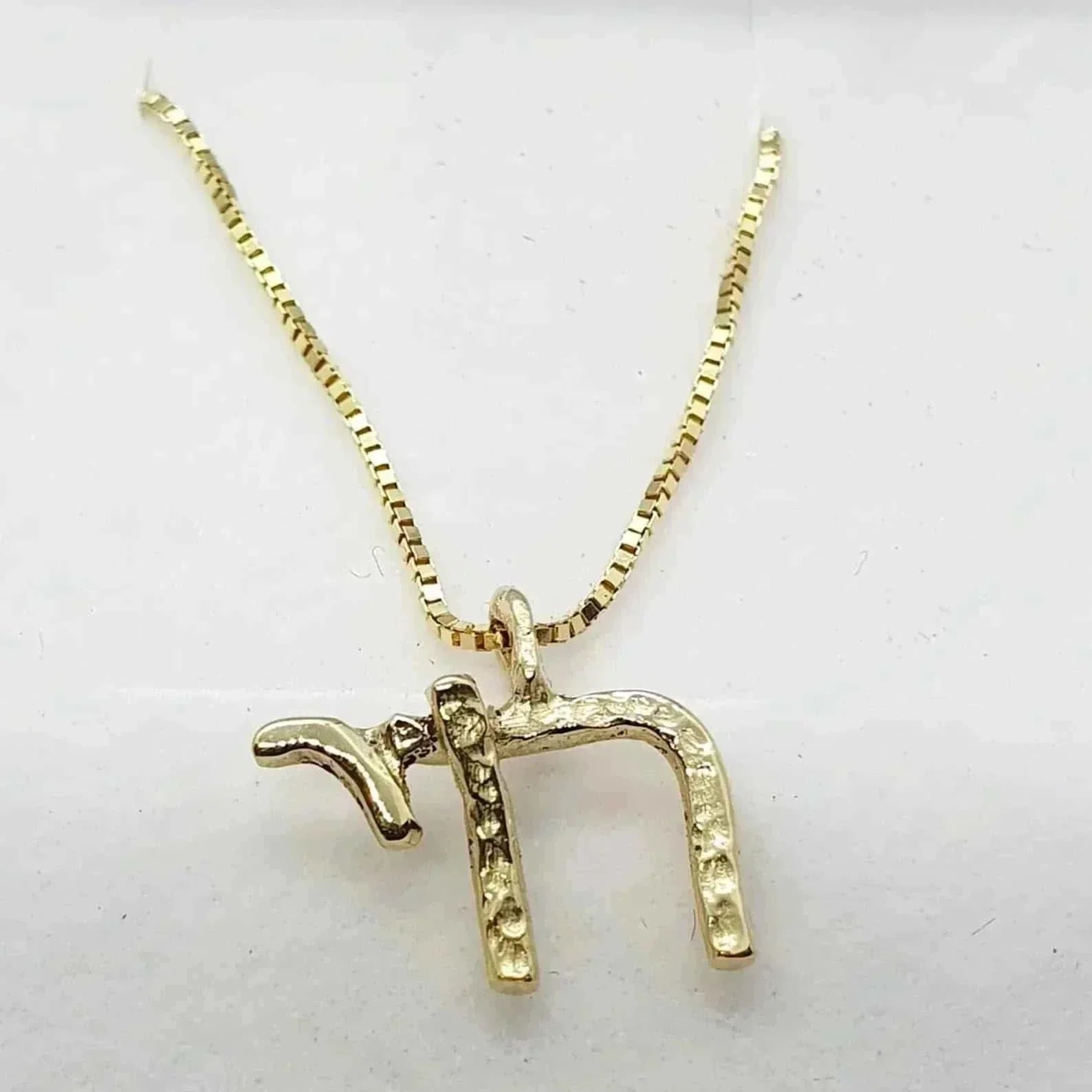 14K gold-plated Chai pendant necklace with Hebrew symbol for life, designed by Talya Harel.