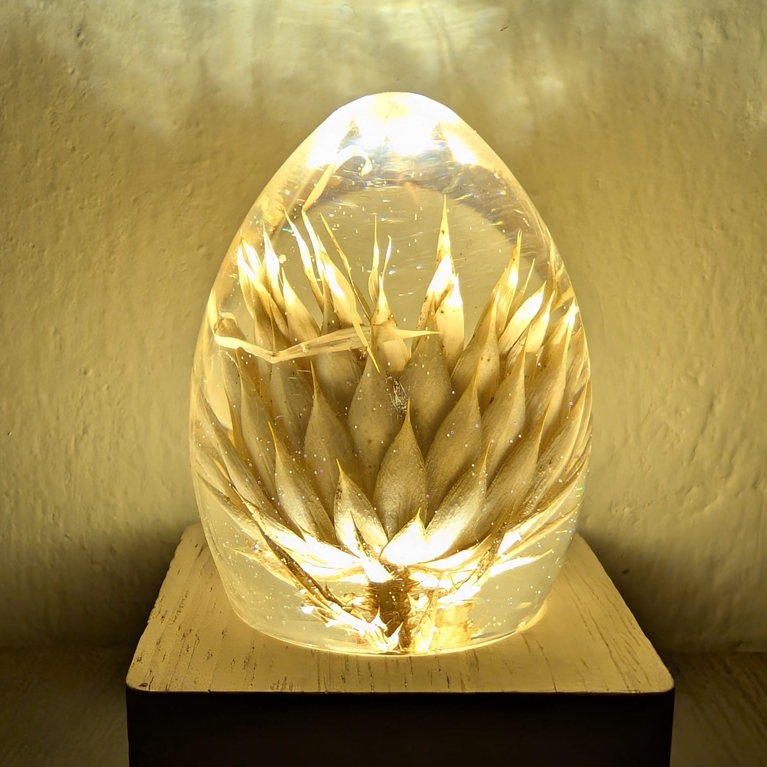 Handmade epoxy lamp with Israeli dried flowers glowing inside by Epoxy Lady