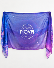 Nova Shawl — Purple, lightweight sheer fabric with a blue-purple galaxy print, pink edges and bold white NOVA logo.