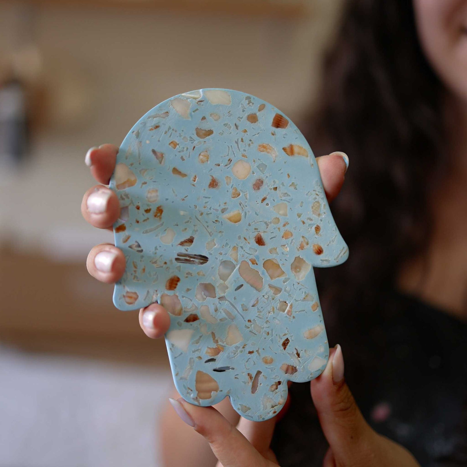 Handcrafted Israeli seashell terrazzo Hamsa wall decor by Made By Dalia