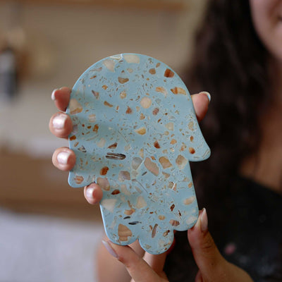 Handcrafted Israeli seashell terrazzo Hamsa wall decor by Made By Dalia