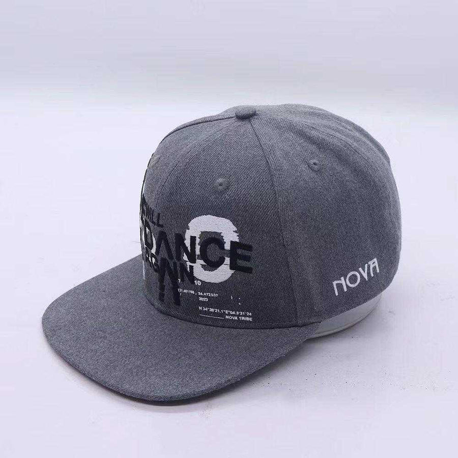 Grey snapback cap in textured fabric, featuring bold Nova We Will Dance Again lettering and a white Nova logo.