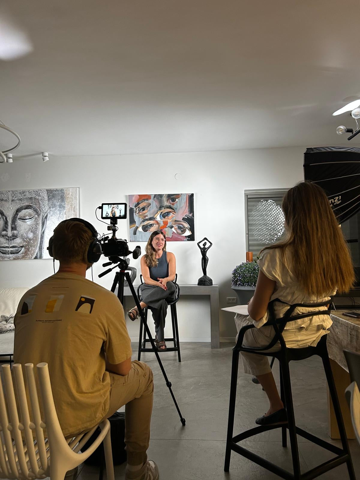 An Israeli entrepreneur sharing her story during a filmed interview in her art studio